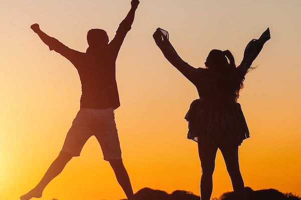 Energetic people Energetic people in silhouette jumping at sunset in an outdoor environment